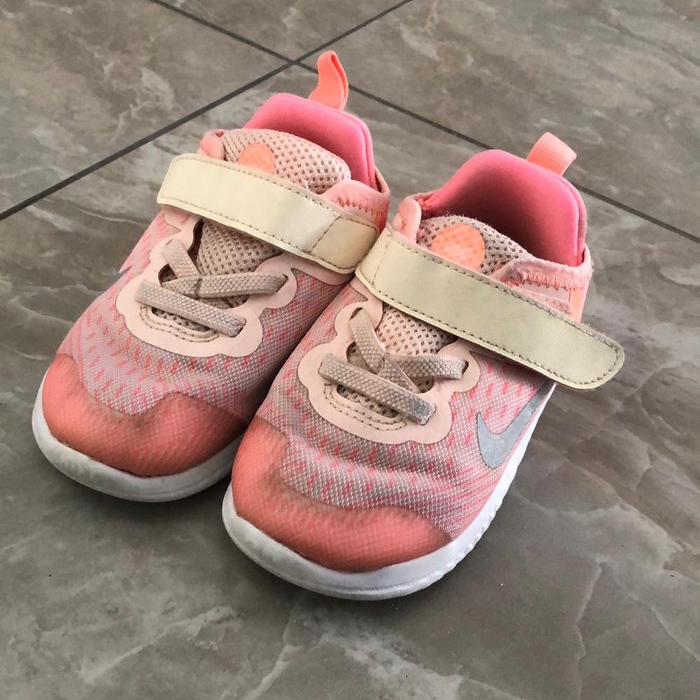 Neon peachy pink Nike sneakers
